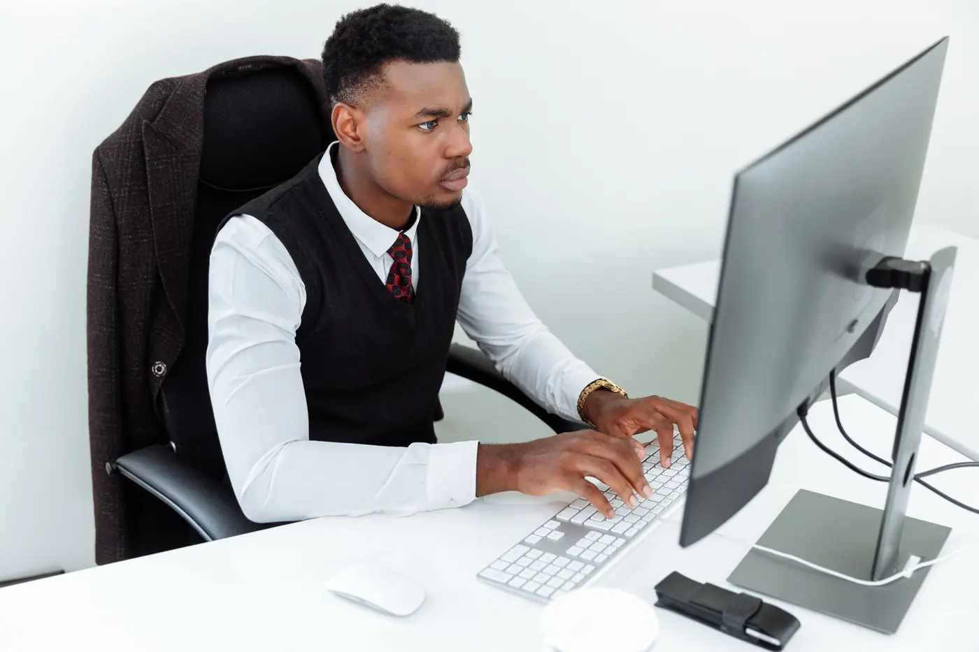 Lawyer reviewing AI tools on computer at modern law firm